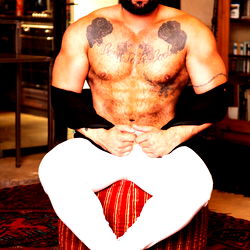 Powerful Bodybuilder Striking a Pose in His Dominating Role