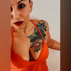 Alessia in a Red Dress, Smiling and Posting