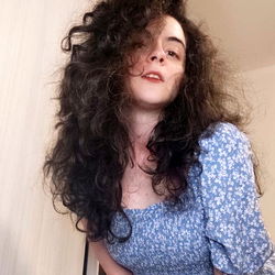 Italian Fashion Model with Curly Hair in Casual Outfit