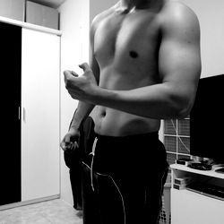 A Young Man in an OnlyFans Modeling Shirt