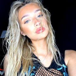 Blonde Angel Poses in Tattooed Dress