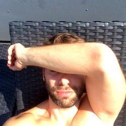 Muscular Man Resting on Lawn Chair