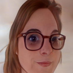 Woman in Glasses with Blue Eyes