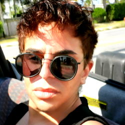 Young Man in Car Sunglasses