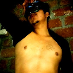 Striking pose on a brick wall