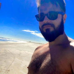 Fitness enthusiast enjoying a sunny day at the beach