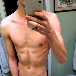 OnlyFans Model in Bathrobe Shares Shirtless Gym Mirror Photo