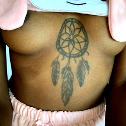 Vibrant Tattoo Showcasing a Colorful Dreamcatcher Design