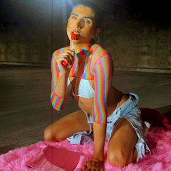 Vivid and colorful photo of an OnlyFans model posing for a promotional shoot