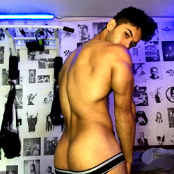 Scantily Clad OnlyFans Model in a Bedroom