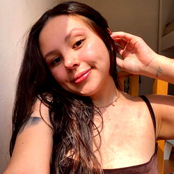 Long-haired woman posing with phone