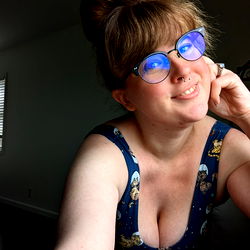 Woman in colorful top leaning on arm