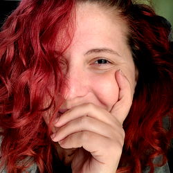 A Woman with Red Hair and Tattoos