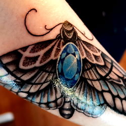 Stylish Tattoo on Arm with Butterfly Design