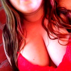 A Brick Wall is the Backdrop for a Surprised Model