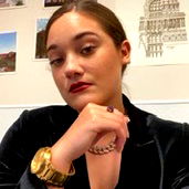 Amethyst, a confident individual from Texas poses with hands on hips