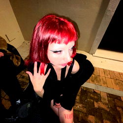 Model with Red Hair and Tattoo