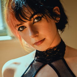 Annie, A 20-Year-Old Model with Vibrant Colored Hair and a Stylish Outfit