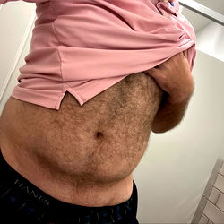 Candid Camera Catches Man in the Act of Showing Off His Belly