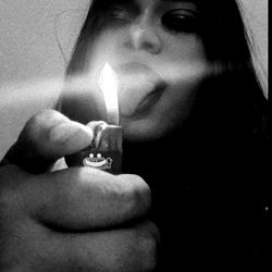 A Model Posing with a Lit Zippo Lighter