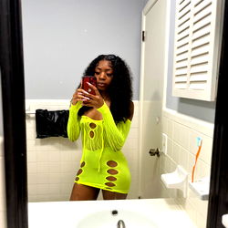 Auburn-haired model in a yellow outfit and fringe detailing