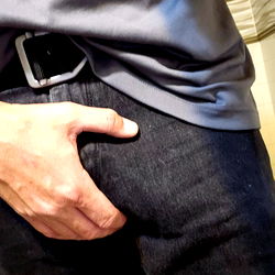 Casually Dressed Man with Phone in Pocket