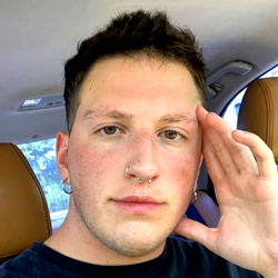 Exuding a laid-back vibe, Philly model poses confidently with hand on head