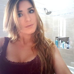 Woman in Bathroom Mirror