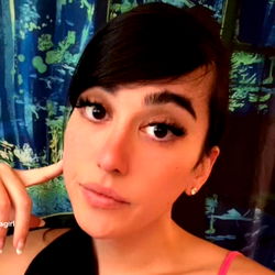 Stylish model with a neutral expression posing for a portrait