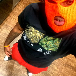 Vibrant Masked Individual with Orange Mask, Red Shirt, and Black T-shirt