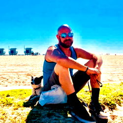 Relaxed John Poses on Beach