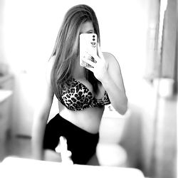 Stylish Anastasia in a bathroom mirror