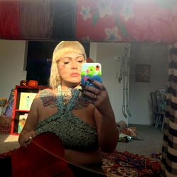 Ashley's Playful Pose in a Cozy Corner