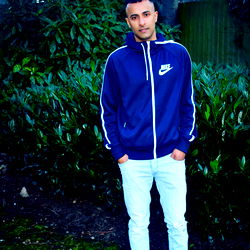 Model Standing Outdoors in Blue, White and Yellow