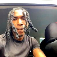 Atlanta-based Model with Braided Hair in a Black Vehicle
