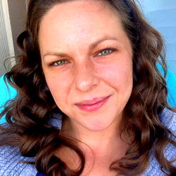 A Woman Smiling in a Casual Setting