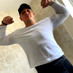 Strong and Muscular Fitness Model Poses for the Camera