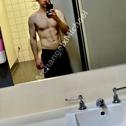 Strong and Buff Archangel Michael in Gym Mirror