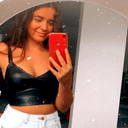 A Model Snap in a Bathroom Mirror