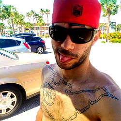 Airbornx2n1 from Florida - Muscular Tattooed Man in Red Hat and Sunglasses
