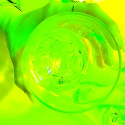 Vividly Green Neon Drinks with Ice Cubes on a Tabletop