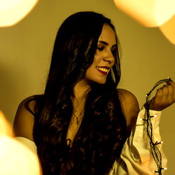 Anastasia, Colombian Model in Blurred Lighting with String Lights