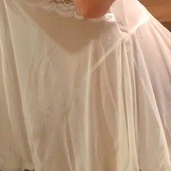 Cute Model in a White Dress Posing for the Camera