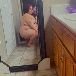 A Babbyydollsin OnlyFans Model in a Bathroom