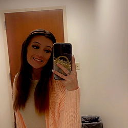 Smiling Woman in Onlyfans Outfit