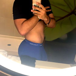 Fitness Guru Justin James Posing in Mirror