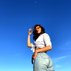 Angelito, a Model in Jeans and Sunglasses on the Beach