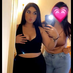 Model Posts a Selfie with Her Friend, Both Posing in Casual Clothes and Makeup