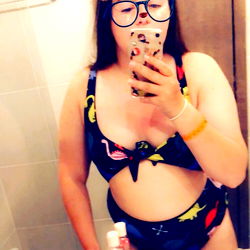 Fun and Funky Bathing Suit Model Showcasing Style in the Mirror