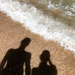 A romantic beach scene with Elli and a companion
